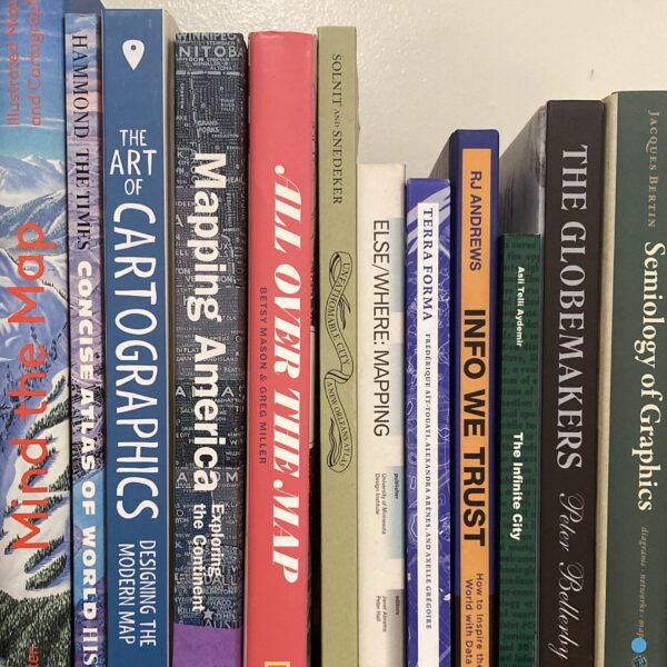 A photo of some cartography books on a shelf