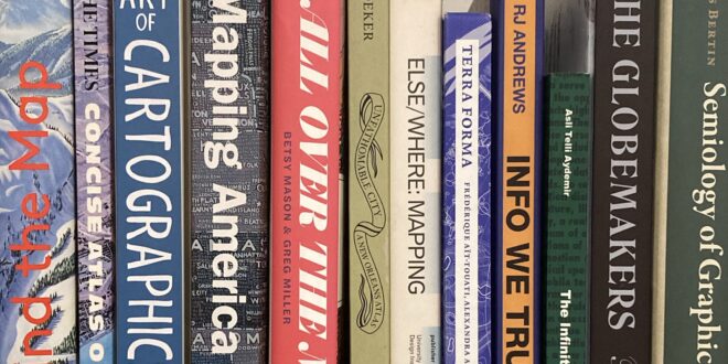 A photo of some cartography books on a shelf